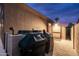 Exterior shot of a covered grill area and storage shed with pavers for backyard enjoyment at 3488 N Lady Lake Ln, Casa Grande, AZ 85122