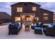 Inviting backyard with outdoor seating area, built in barbeque and lounge setting at 3488 N Lady Lake Ln, Casa Grande, AZ 85122
