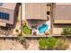 Aerial view of a backyard featuring a pool, putting green, and patio furniture at 3488 N Lady Lake Ln, Casa Grande, AZ 85122