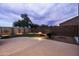 This spacious backyard showcases a putting green and patio at 3488 N Lady Lake Ln, Casa Grande, AZ 85122
