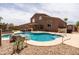 Expansive backyard featuring a swimming pool, hot tub, putting green, and covered patio at 3488 N Lady Lake Ln, Casa Grande, AZ 85122