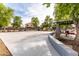 Community basketball court, picnic shelter, and tables, surrounded by shade trees at 3488 N Lady Lake Ln, Casa Grande, AZ 85122