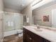 Well-lit bathroom with a modern vanity, framed mirror, and a shower/tub combo at 3488 N Lady Lake Ln, Casa Grande, AZ 85122