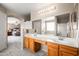 Bright bathroom featuring double sinks and convenient access to the bedroom and shower at 3488 N Lady Lake Ln, Casa Grande, AZ 85122