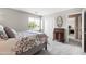 Cozy bedroom featuring soft carpet, natural light, and a decorative writing desk at 3488 N Lady Lake Ln, Casa Grande, AZ 85122