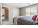 Bright bedroom with a sliding-door closet, and a view to the hall with natural light at 3488 N Lady Lake Ln, Casa Grande, AZ 85122