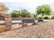 Stone community sign for Avalon, surrounded by desert landscaping and trees at 3488 N Lady Lake Ln, Casa Grande, AZ 85122