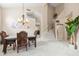 Dining area with chandelier and staircase access, offering plenty of room for gatherings in a welcoming space at 3488 N Lady Lake Ln, Casa Grande, AZ 85122