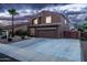 A well-kept two-story home with a wide driveway and desert landscaping offers suburban charm at 3488 N Lady Lake Ln, Casa Grande, AZ 85122