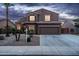 Attractive home featuring rock landscaping, a wide driveway, and a well-maintained facade at 3488 N Lady Lake Ln, Casa Grande, AZ 85122