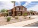 Inviting front exterior with mature palm trees and desert landscaping, offering great curb appeal at 3488 N Lady Lake Ln, Casa Grande, AZ 85122