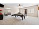 Spacious game room with a pool table, popcorn machine, and plush carpeting at 3488 N Lady Lake Ln, Casa Grande, AZ 85122