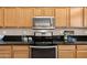 Close-up of the kitchen area featuring stainless steel appliances and granite countertops at 3488 N Lady Lake Ln, Casa Grande, AZ 85122