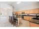 Bright kitchen featuring granite countertops, stainless appliances, an island with seating, and ample cabinet space at 3488 N Lady Lake Ln, Casa Grande, AZ 85122