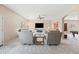 Inviting living room featuring neutral tones, plush seating, and a modern ceiling fan for added comfort at 3488 N Lady Lake Ln, Casa Grande, AZ 85122
