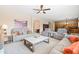 Spacious living room boasts neutral tones, plush seating, and seamless flow into other living areas at 3488 N Lady Lake Ln, Casa Grande, AZ 85122