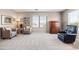 Comfortable living area with plush chairs and a window offering natural light at 3488 N Lady Lake Ln, Casa Grande, AZ 85122