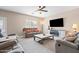 Cozy living room features an entertainment center, recessed lighting, ceiling fan, and comfortable seating at 3488 N Lady Lake Ln, Casa Grande, AZ 85122