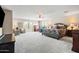 Expansive main bedroom with large windows, a ceiling fan, and sitting area at 3488 N Lady Lake Ln, Casa Grande, AZ 85122