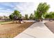 Playground with slides, climbing structures, and benches, surrounded by shade trees at 3488 N Lady Lake Ln, Casa Grande, AZ 85122