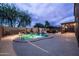 Backyard oasis with a pool, hot tub, and lounge area at 3488 N Lady Lake Ln, Casa Grande, AZ 85122
