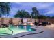 Backyard pool area with hot tub, waterfall, and outdoor seating at 3488 N Lady Lake Ln, Casa Grande, AZ 85122