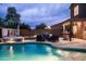 Relaxing backyard featuring a sparkling pool, a hot tub, and an inviting outdoor seating area at 3488 N Lady Lake Ln, Casa Grande, AZ 85122