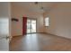 Bright bedroom with wood floors, a sliding glass door to the backyard, and a ceiling fan at 4017 W Irma Ln, Glendale, AZ 85308