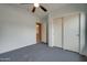 Bedroom featuring vaulted ceiling, closet, neutral walls and carpet at 4017 W Irma Ln, Glendale, AZ 85308
