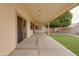 Large covered patio overlooking artificial turf and mature landscaping at 4017 W Irma Ln, Glendale, AZ 85308
