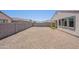Spacious backyard featuring a gravel ground cover and a block wall fence for added privacy at 4467 S 116Th Ln, Avondale, AZ 85323
