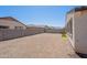 Spacious backyard featuring a gravel ground cover and a block wall fence for added privacy at 4467 S 116Th Ln, Avondale, AZ 85323