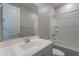Bright bathroom featuring a shower-tub combination and a single sink vanity with a large mirror at 4467 S 116Th Ln, Avondale, AZ 85323