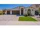 Charming home with a neat lawn area, a two car garage, and a delightful garden area at 4467 S 116Th Ln, Avondale, AZ 85323