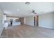 Open floor plan showcases the kitchen and living area, highlighted by wood-look tile floors and recessed lighting at 4467 S 116Th Ln, Avondale, AZ 85323