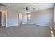 Large bedroom with a ceiling fan, neutral color scheme, and plush carpet for a cozy feel at 4467 S 116Th Ln, Avondale, AZ 85323