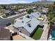 Aerial view of single-Gathering home with lush backyard and sparkling pool in a quiet neighborhood at 4632 E Kachina Trl, Phoenix, AZ 85044