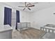 Bedroom featuring carpeted floors, ceiling fan, and backyard view at 4632 E Kachina Trl, Phoenix, AZ 85044