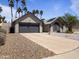 Well-maintained single-Gathering home featuring desert landscaping, a gray roof, and palm trees at 4632 E Kachina Trl, Phoenix, AZ 85044