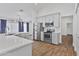 Modern kitchen featuring stainless steel appliances, white cabinets, quartz countertops, and island seating at 4632 E Kachina Trl, Phoenix, AZ 85044