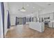 Open-concept living room and kitchen offers tile floors, recessed lighting, and access to the patio at 4632 E Kachina Trl, Phoenix, AZ 85044