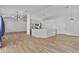 Open layout features tile floors, modern lighting, and a view of the kitchen with stainless steel appliances at 4632 E Kachina Trl, Phoenix, AZ 85044
