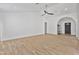 Bright, open-concept living room boasts tile floors, vaulted ceiling, and easy access to front door at 4632 E Kachina Trl, Phoenix, AZ 85044