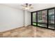 Bright bedroom with travertine floors and large window at 4808 N 24Th St # 231, Phoenix, AZ 85016