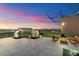 Rooftop deck at twilight featuring two built-in grills, outdoor furniture, and mountain views at 4808 N 24Th St # 231, Phoenix, AZ 85016
