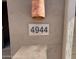 Close-up of the house number '4944' affixed to the exterior wall at 4944 E Villa Theresa Dr, Scottsdale, AZ 85254