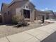 Southwest-style home featuring desert landscaping, and an attached two-car garage at 4944 E Villa Theresa Dr, Scottsdale, AZ 85254