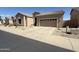 Desert-landscaped front yard with gravel and desert plants around a tan home at 4944 E Villa Theresa Dr, Scottsdale, AZ 85254