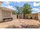 Cozy backyard area with gravel, pavers, and storage shed, providing practical outdoor space at 4953 W Acoma Dr, Glendale, AZ 85306