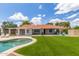 Lush backyard with sparkling pool, diving board, and ample patio space for entertaining at 4953 W Acoma Dr, Glendale, AZ 85306